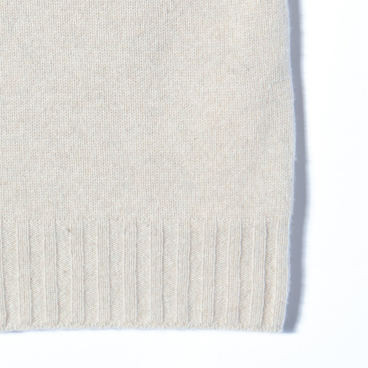 SLEEVELESS ROLL NECK KNIT