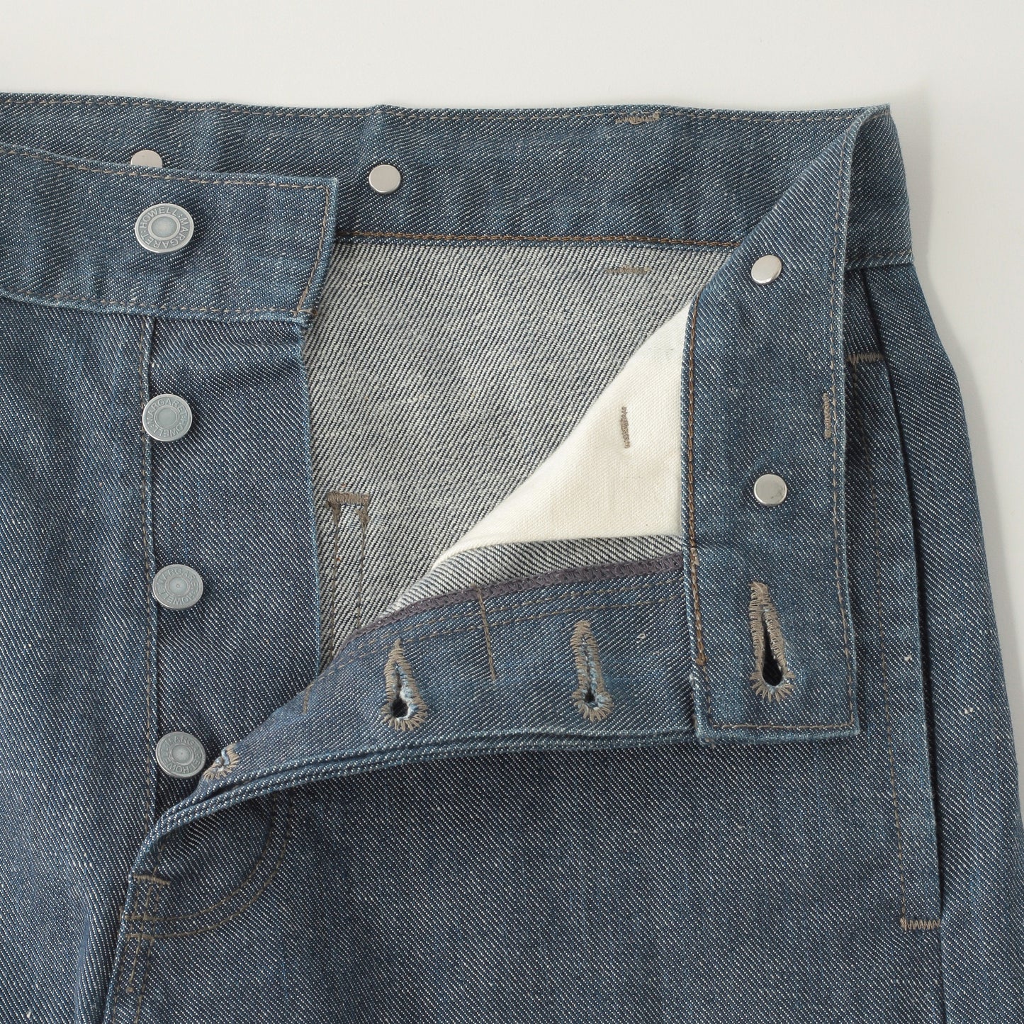 GREY CAST DENIM TROUSERS