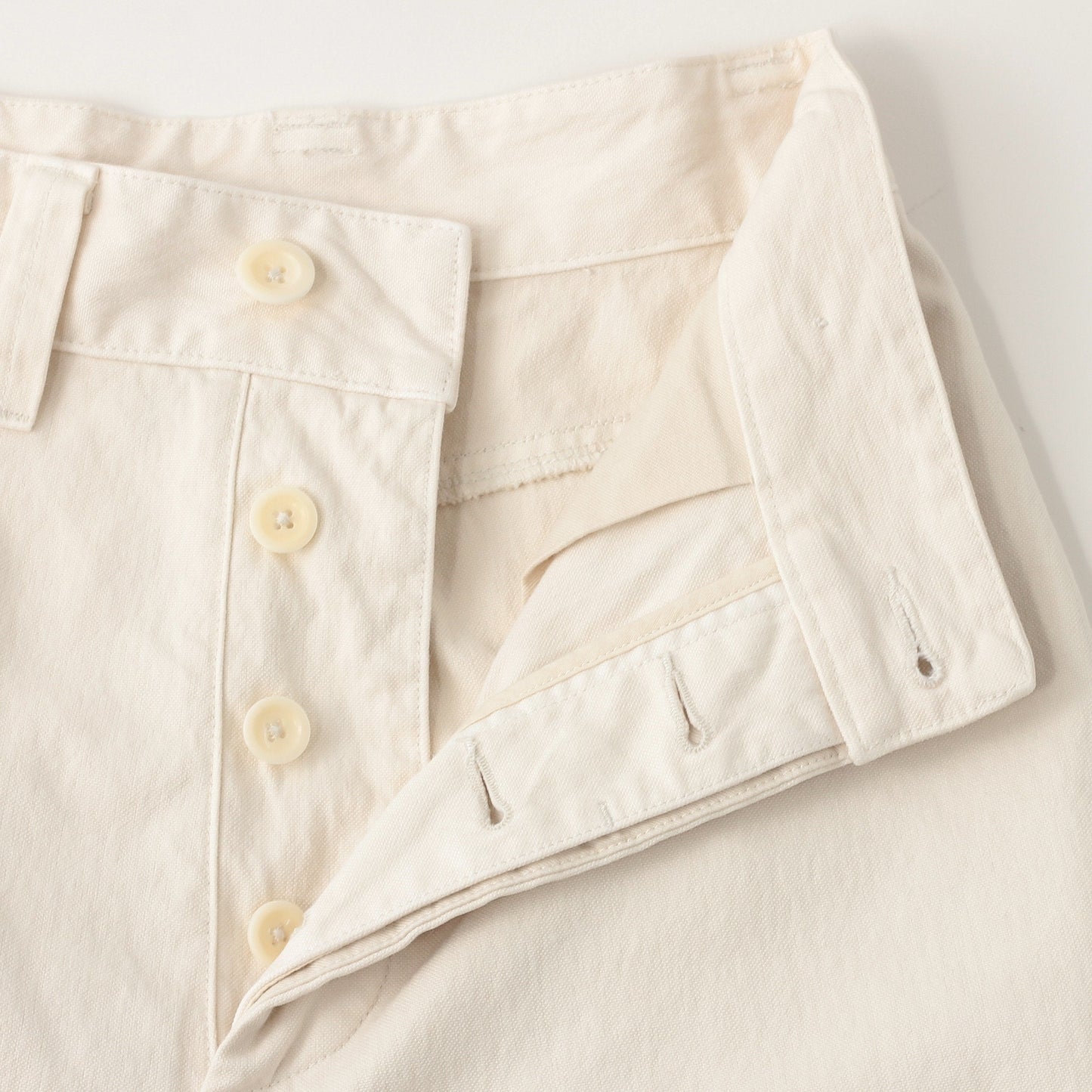 UNEVEN COTTON CANVAS TROUSERS