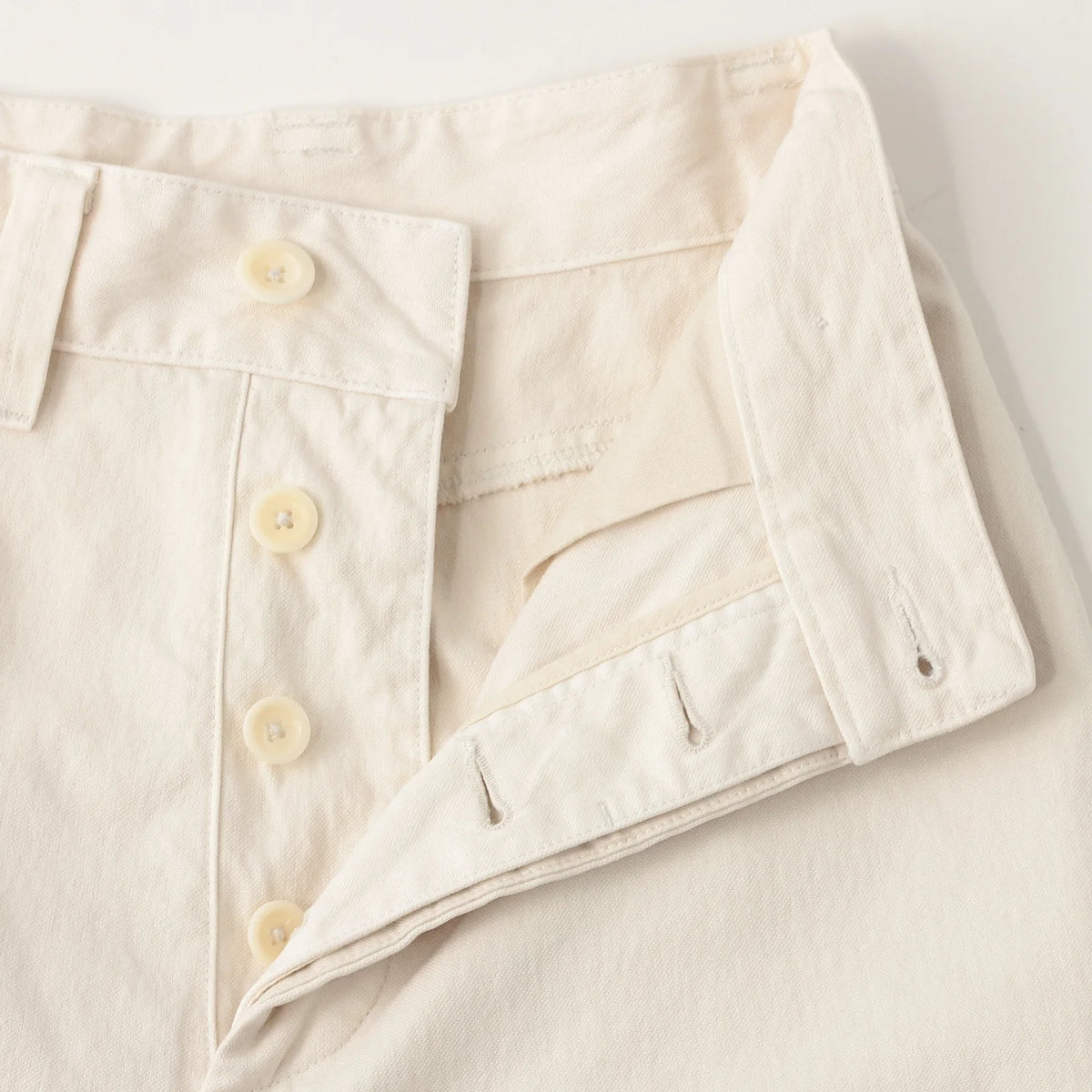 UNEVEN COTTON CANVAS TROUSERS