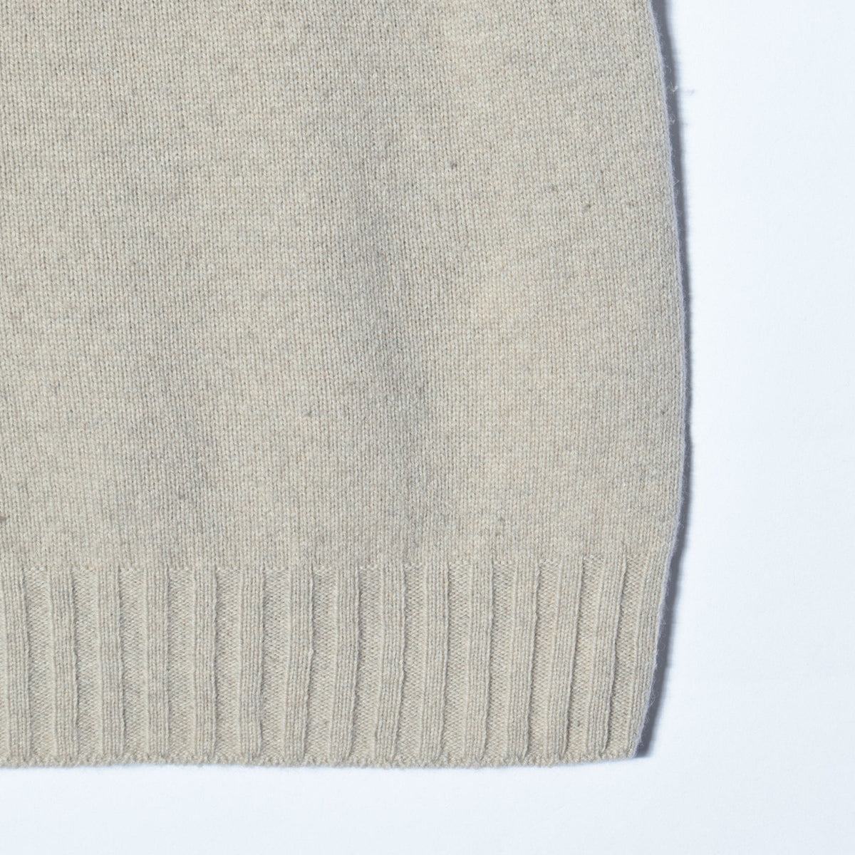 SLEEVELESS ROLL NECK KNIT