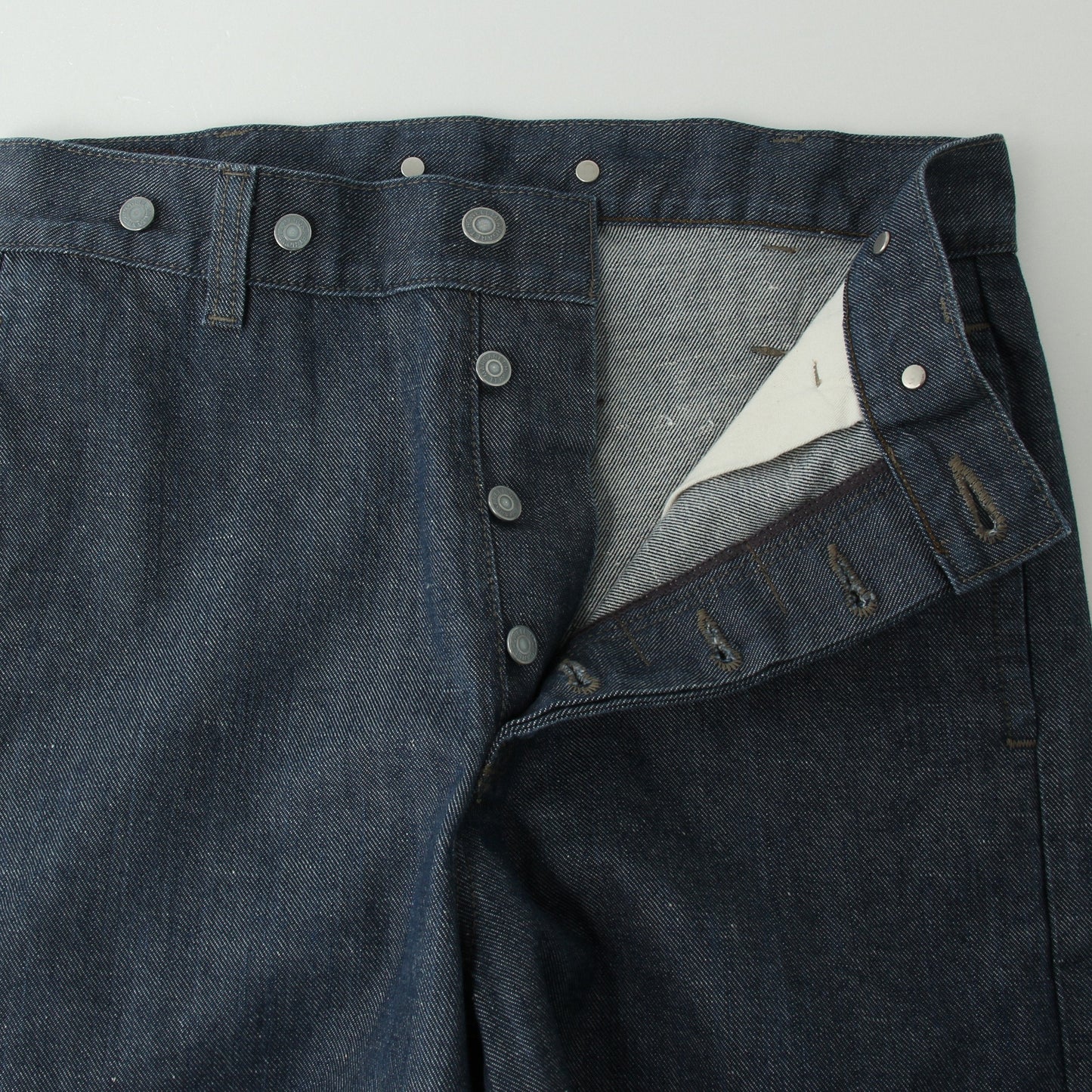 GREY CAST DENIM TROUSERS