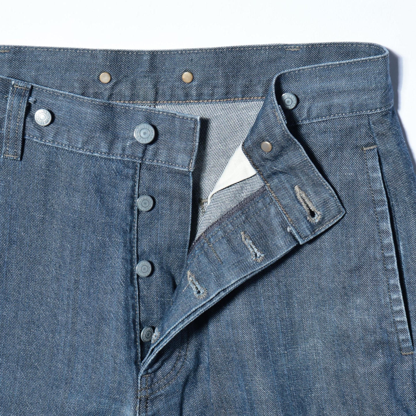 GREY CAST DENIM TROUSERS
