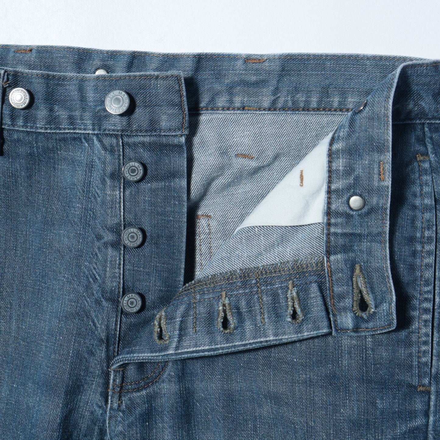 GREY CAST DENIM TROUSERS
