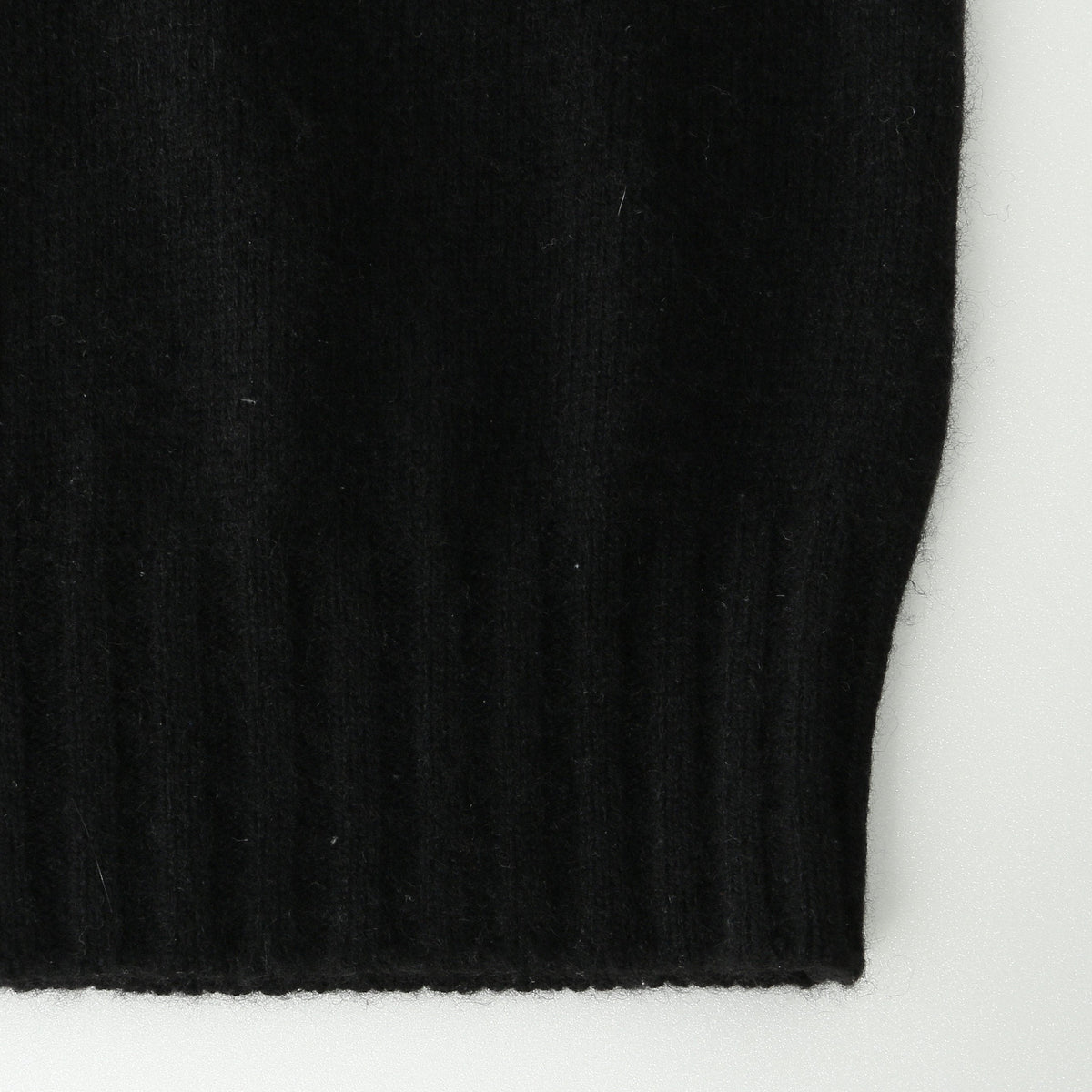 CASHMERE SLEEVELESS ROLL NECK KNIT